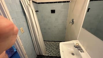 Shower, towels, soap, toilet paper