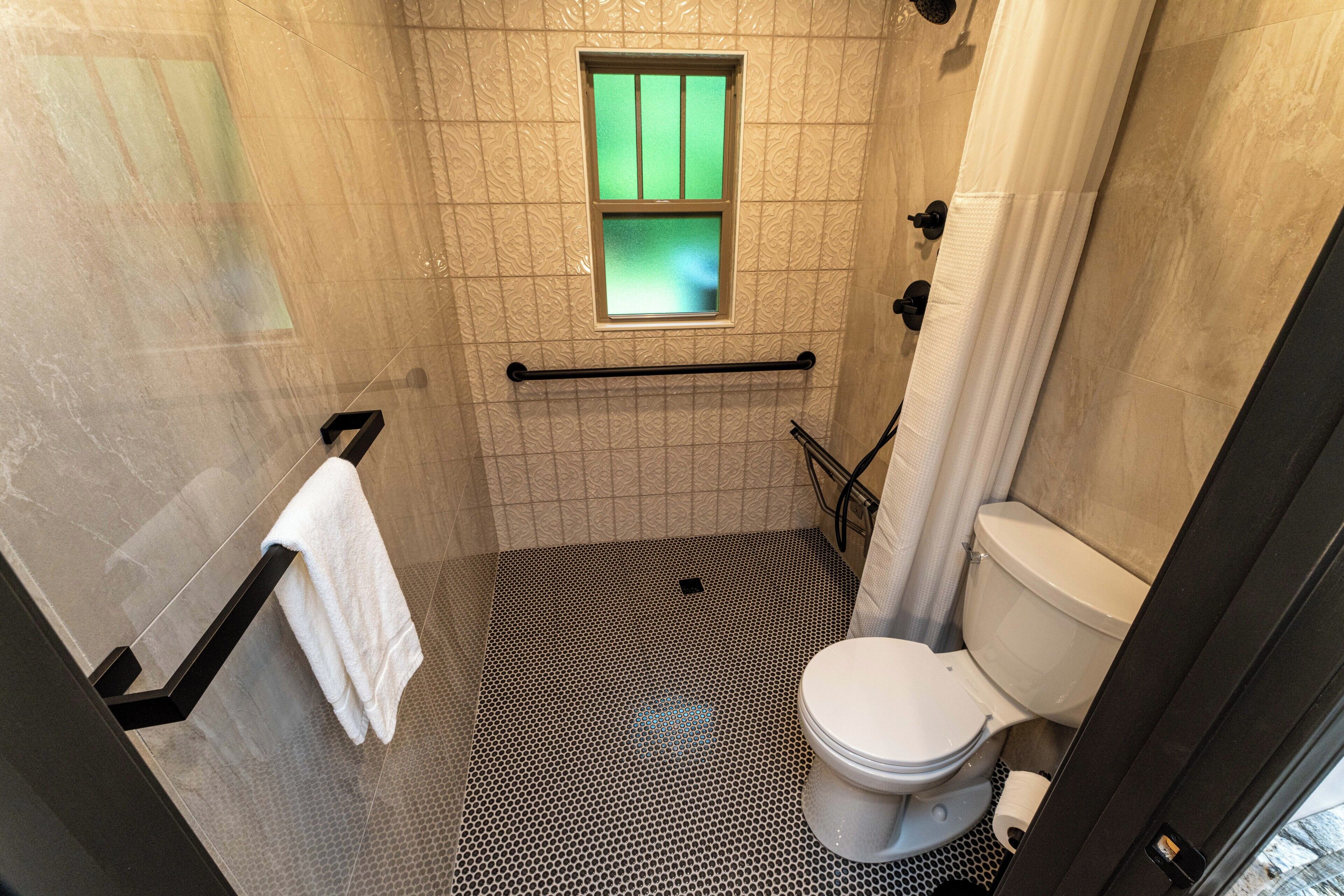 Single Room, 1 Queen Bed, Accessible | Bathroom | Shower, free toiletries, hair dryer, towels