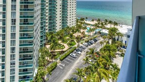 A high-rise hotel with multiple balconies overlooking a beach and ocean. - Haven Beach Gem Condo in Hollywood (Hollywood)