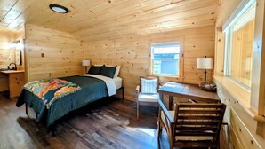 A wooden cabin room with a bed, desk, chair, and a window. - Cabin at the lake, Free Kayaks, Hiking & Fishing (Franklin)
