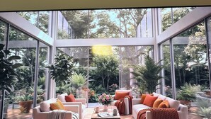 A modern living room with large windows, a sofa set, and a coffee table. - Cozy 1-bedroom apartment in pleasant Hollywood  Downtown ,pool and gym access. (Hollywood)