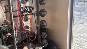 A gym with exercise equipment, including a rowing machine and multiple exercise balls. - Cozy 1-bedroom apartment in pleasant Hollywood  Downtown ,pool and gym access. (Hollywood)
