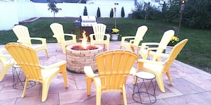 A patio with yellow Adirondack chairs arranged around a fire pit. - 6 Bedroom/6 Bathroom Dog Friendly Wisconsin Dells 13 min, Cascade Ski Hill 6min (Portage)