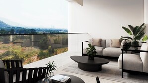 A modern balcony with a sofa, a coffee table, and a chair. - BRAND NEW The Palm Reserve Luxury Beach Villa Thailand (4 bedrooms/ 5 bathrooms) (Pak Nam Pran)
