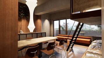 Un intérieur moderne comprenant un coin repas, un escalier et une vue sur l’extérieur.