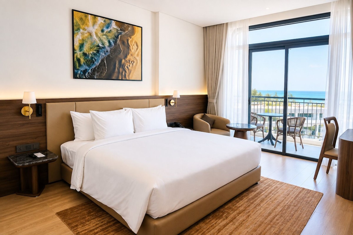 Deluxe Room, 1 King Bed, Beach View | In-room safe, blackout drapes, iron/ironing board, WiFi (free)