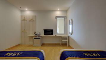 Habitación ejecutiva con 2 camas individuales | Escritorio, wifi gratis y ropa de cama