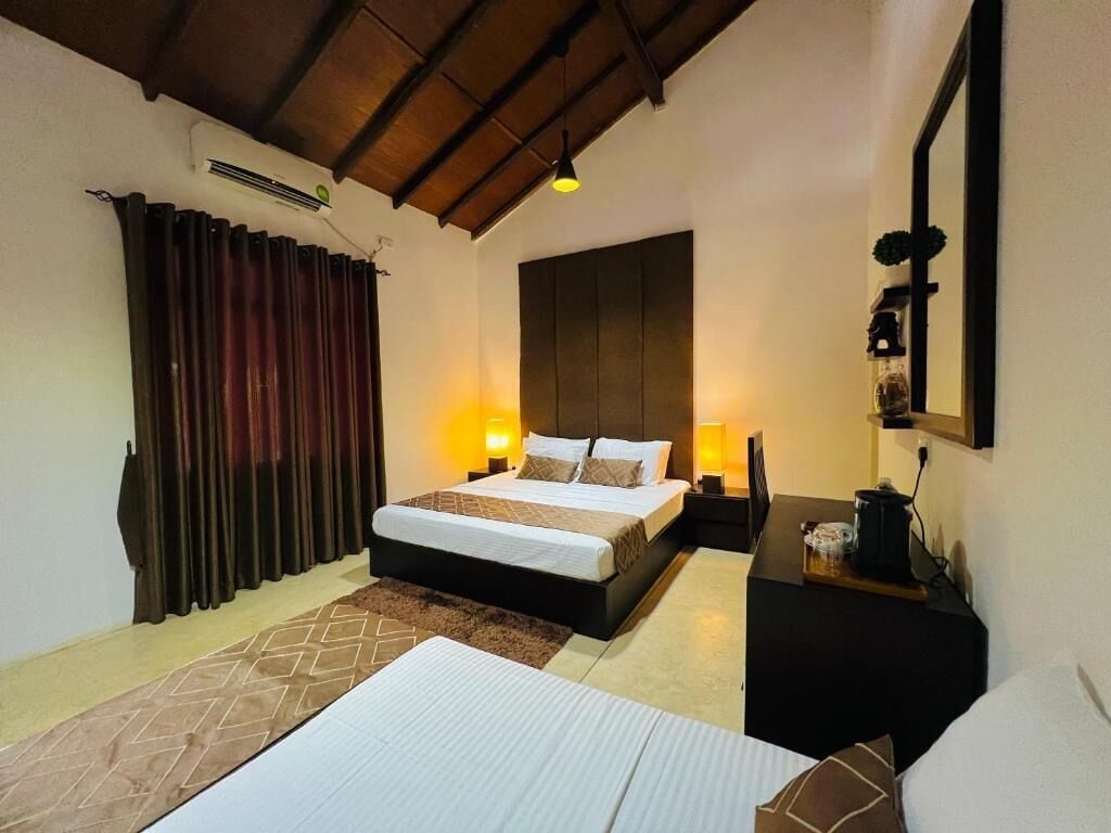 Deluxe Triple Room, Garden View | Soundproofing, iron/ironing board, free WiFi