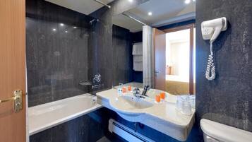 Bathtub, free toiletries, hair dryer, towels
