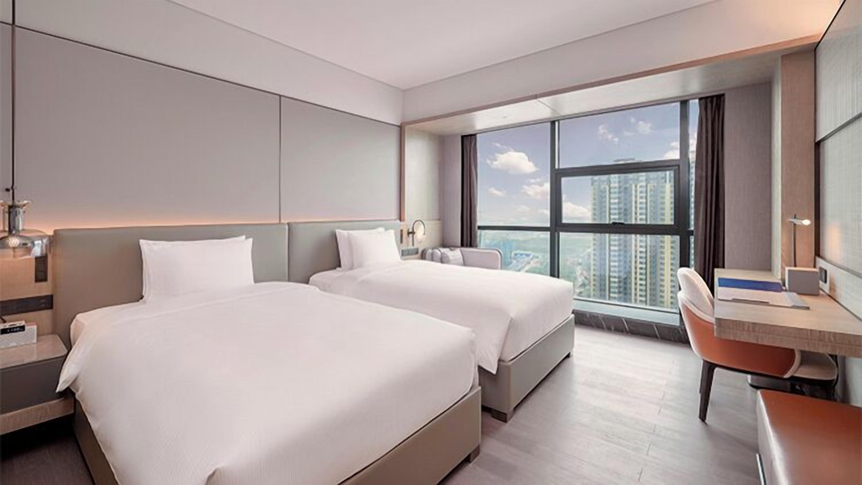 Deluxe Twin Room, City View | In-room safe, desk, blackout curtains, iron/ironing board