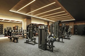 A gym with various exercise equipment, including weight machines and dumbbells. - BASE LAYER HOTEL UNION NAGOYA SAKAE (Nagoya)