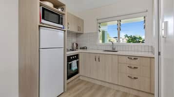 Apartment, Balcony, Sea View | Private kitchen | Full-size fridge, microwave, oven, stovetop