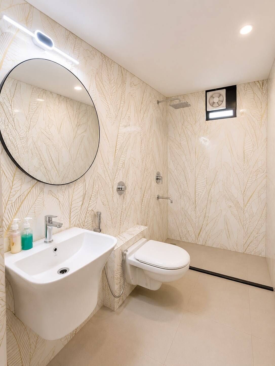 A modern bathroom with a large mirror, a sink, a toilet, and a shower.