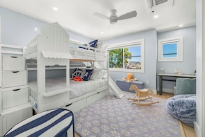 A children's bunk bed with a slide, a rocking horse, and a window with a view. - Santa Cruz Escape-Rooftop Deck/Ocean Views/Hot Tub (Santa Cruz)