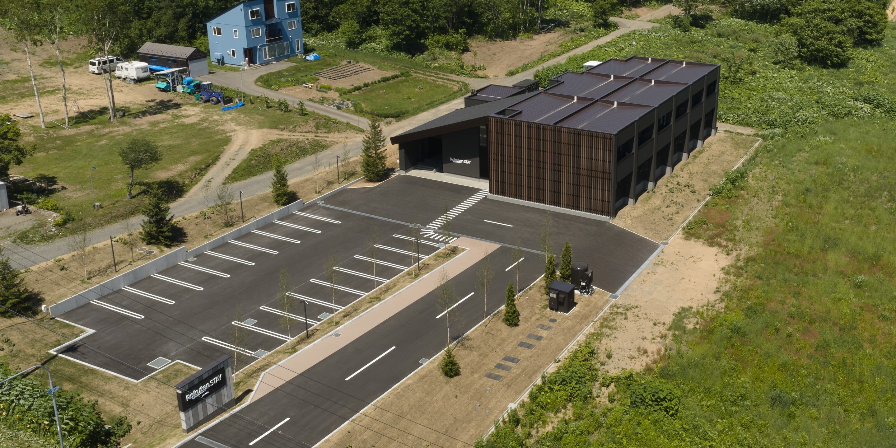 An aerial view of a parking lot with a building labeled 'Recreation Stay.'