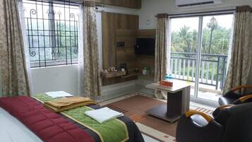 Deluxe Double Room, Balcony, Garden View | Laptop workspace, blackout curtains, soundproofing, iron/ironing board