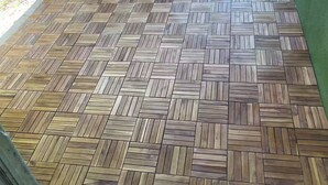 A wooden herringbone-patterned floor with a green wall and a window frame. - Waterfront getaway, relaxation done right here (Fort Myers)