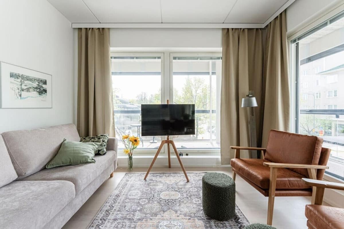 Deluxe Apartment, Balcony, City View, No Pets Allowed | Living area | 55-inch Smart TV with cable channels