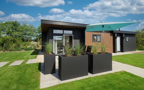 Chalet Strandloper K04 privately situated near Northsea and beach of Renesse