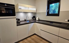 Coffee/tea maker, fridge, microwave, oven