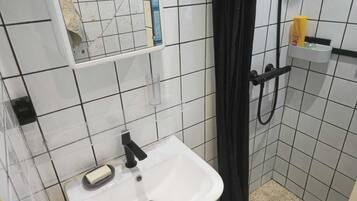Shower, towels, soap, toilet paper