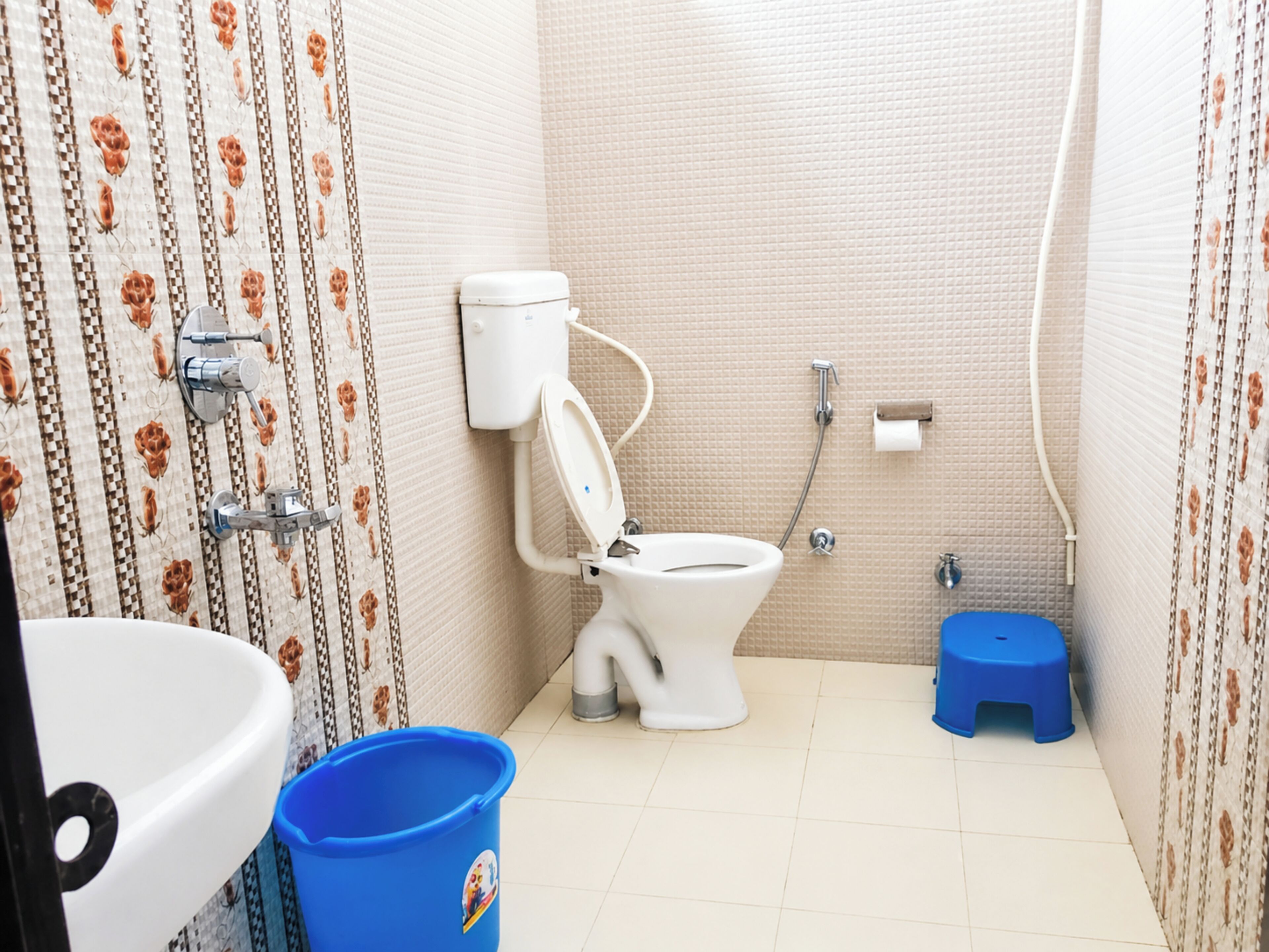 Shower, rainfall showerhead, slippers, towels