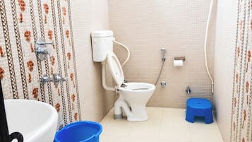 Shower, rainfall showerhead, slippers, towels