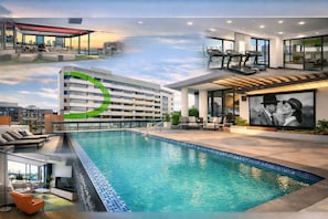 A modern hotel with a swimming pool, outdoor seating, and a city view. - Luxe-valley 2BR 2bath Infinity Pool (Brisbane)