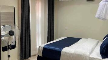 Apartment, Balcony, City View | Iron/ironing board, WiFi (free)