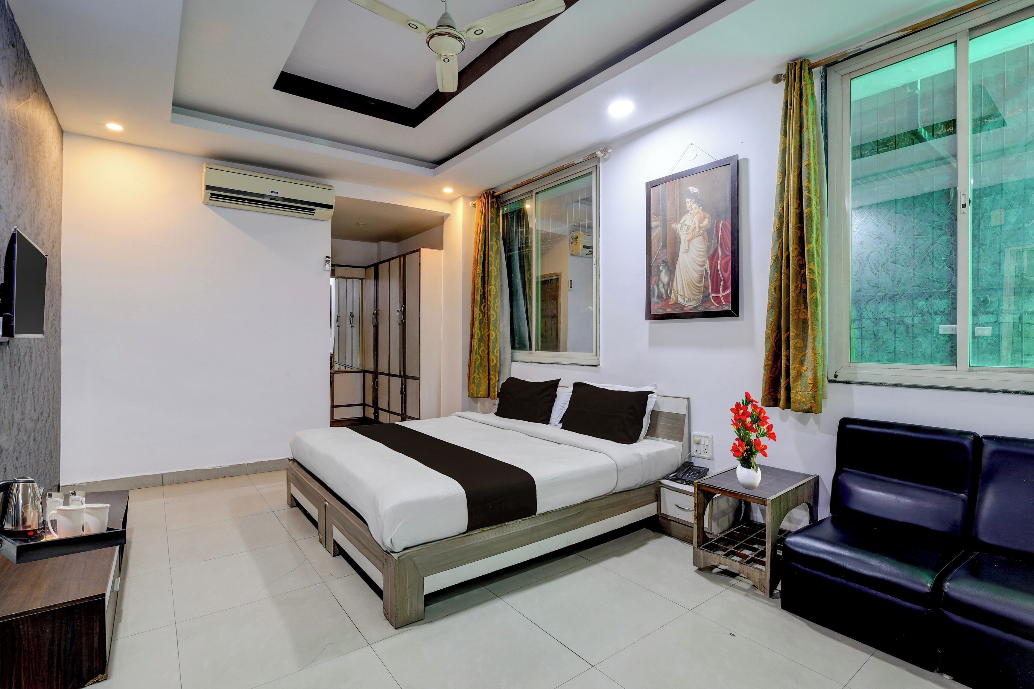 A modern bedroom with a bed, bedside table, and a chair.