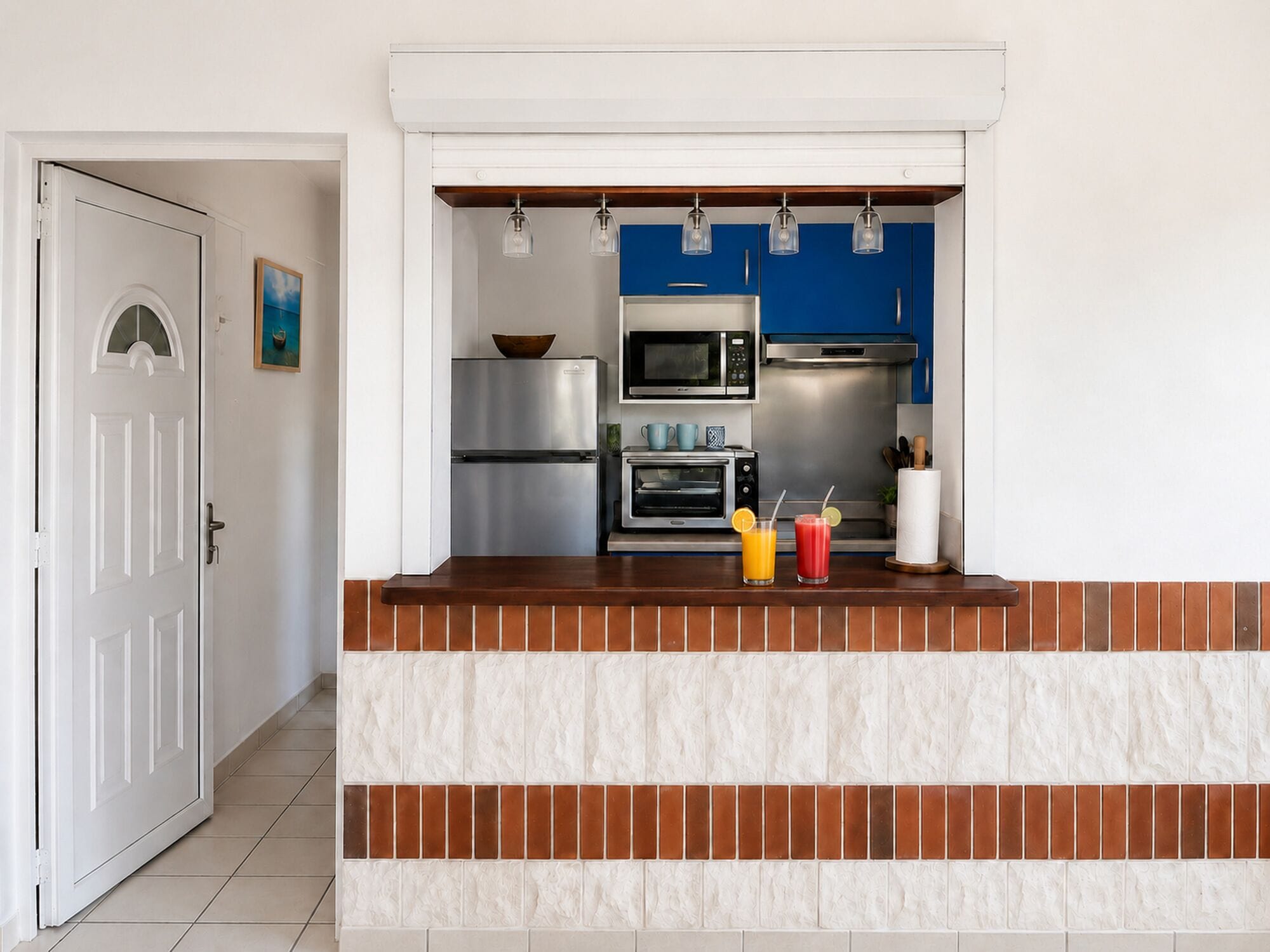 A modern kitchen with a built-in microwave, oven, and refrigerator.