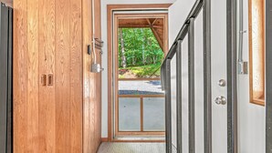 A wooden door with a metal handle and a small window. - Whispering Oaks Dome Retreat / Sleeps 9 / Private Woodland Escape (Saint Croix Falls)