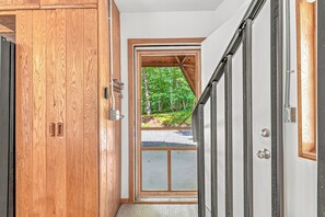 A wooden door with a metal handle and a small window. - Whispering Oaks Dome Retreat / Sleeps 9 / Private Woodland Escape (Saint Croix Falls)