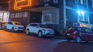 A building with large illuminated billboards advertising video games. - The 260 Collection Luxury City Apartment (Johannesburg)