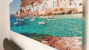 A coastal scene with buildings and boats. - Villa Rosalia with Heated Private Jacuzzi & Sunset View (Tonnara di Bonagia VALDERICE)