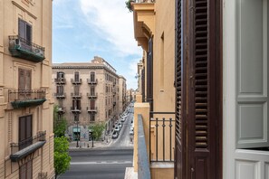 A street view with buildings, a clear sky, and a road. - Roma 1923 - Casa Blu by Wonderful Italy (Palermo)