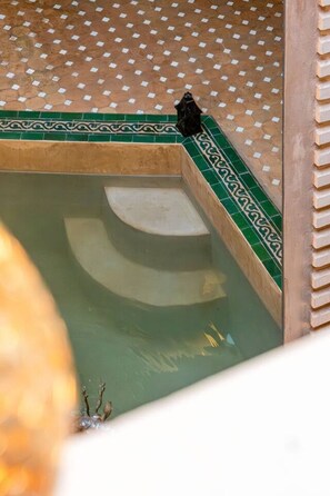 A small pool with steps leading into it, surrounded by patterned tiles. - Riad Jad • 5BR • Pool • Breakfast • Rooftop (Marrakesh)