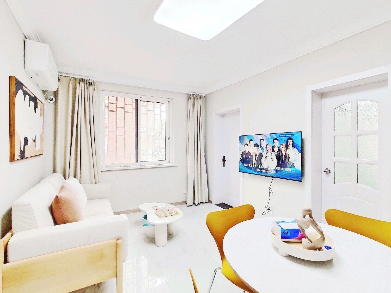 Comfort Suite | Living area | 50-inch flat-screen TV with cable channels