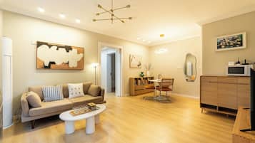 Classic Suite | Living area | 50-inch flat-screen TV with cable channels