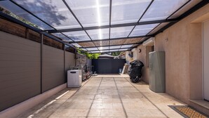 A covered outdoor area with a tiled floor, a grill, and a refrigerator. - (107) A la Joie de vivre 2 (Cannes)