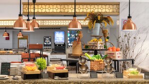 A buffet setup with various food items and serving utensils. - Zhongjian Xingfu Hotel (Hankou Railway Station Branch), Wuhan (Wuhan)