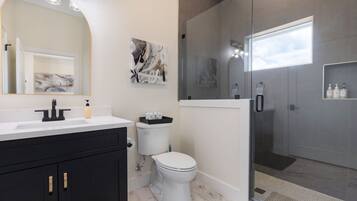 Shower, hair dryer, towels, shampoo