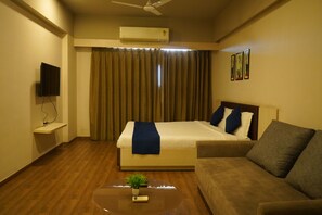 Deluxe Room, Balcony, Pool View | Desk, laptop workspace, iron/ironing board (on request), WiFi (free) - Wow Studio at Weekend Address (Surat)