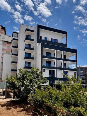 A multi-story residential building with balconies, a flat roof, and a clear sky. - "Onyx" – Adults Only (+16) (Saranda)