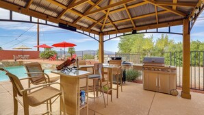 An outdoor patio with a covered area, a pool, and a barbecue setup. - 2 Mi to Lake Havasu! Mtn-view Poolside Paradise (Lake Havasu City)
