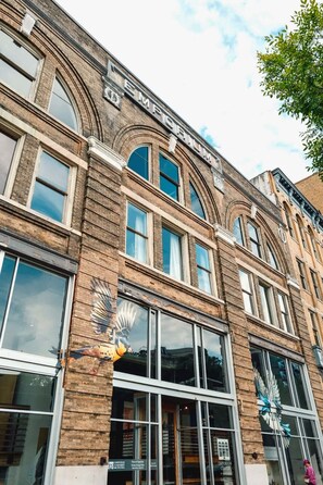 A multi-story building with large windows and a sign that reads 'EMPORIUM CENTER'. - Downtown Knoxville Loft | Near Market Square, UT & Neyland | Free Parking (Knoxville)