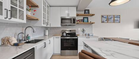 Coffee/tea maker, fridge, microwave, oven