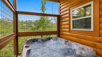 Cabin, 4 Bedrooms | Outdoor spa tub