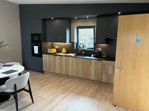 Coffee/tea maker, fridge, microwave, oven