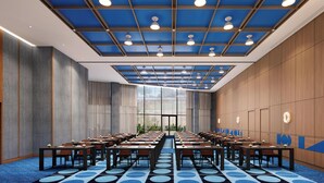 A conference room with a blue ceiling, wooden panel walls, and a patterned carpet. - M Social Hotel Sunnyvale (Sunnyvale)